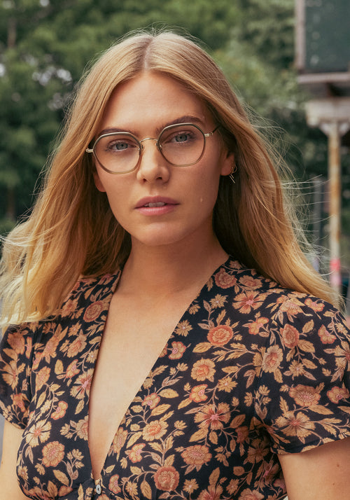 KREWE - LEIGHTON | 12K Titanium + Wasabi handcrafted, luxury green gradient octagonal eyeglasses with 12K gold plated metal hardware womens model campaign | Model: Maritza