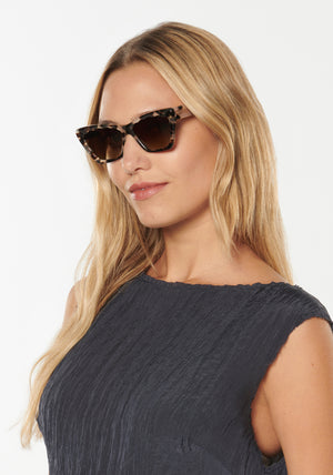 BRIGITTE | Malt Polarized Handcrafted, luxury brown tortoise acetate cat-eye scalloped polarized KREWE sunglasses womens model | Model: Erica