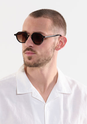 DAKOTA | Black 18K Handcrafted, luxury, Black acetate with gold bridge and hardware KREWE sunglasses mens model | Model: Connor