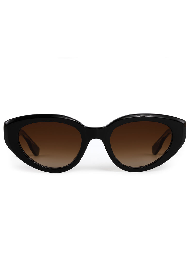 IRENE | Handcrafted, luxury black and black tea acetate medium sized upswept oval wrap KREWE sunglasses
