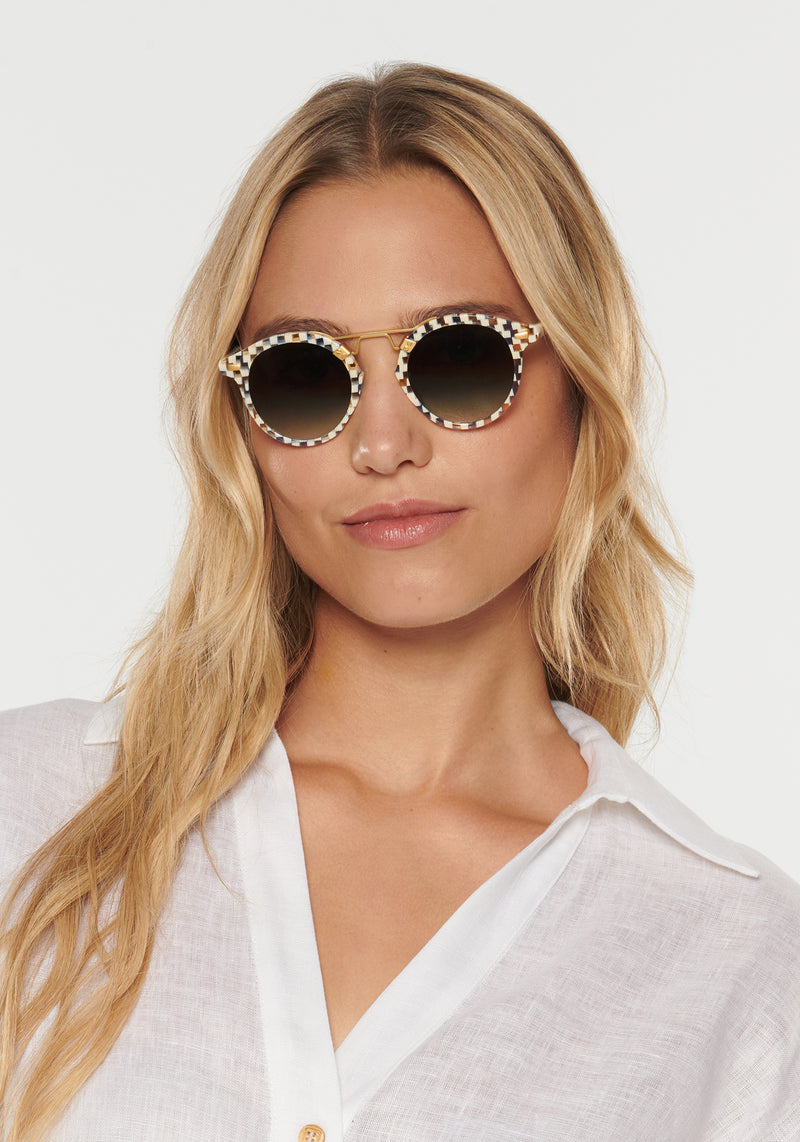 KREWE - Designer Round Sunglasses - ST. LOUIS CLASSICS | Pincheck 18K Handcrafted, luxury blue and white checkered acetate round sunglasses with a double metal bridge. A bestseller. Oliver Peoples Sunglasses, Moscot sunglasses womens model | Model: Erica
